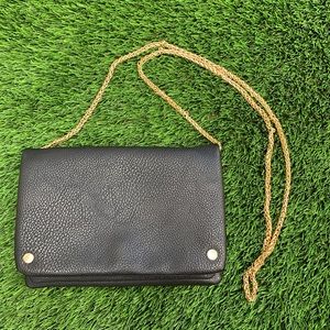 Black faux leather and gold purse clutch